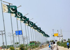 A beautiful view of national flags waving on the electric poles at Qasimabad