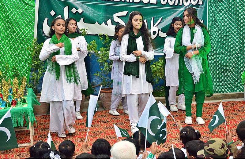 Students are performing tableau in connection with Pakistan Independence Day celebrations at RC School