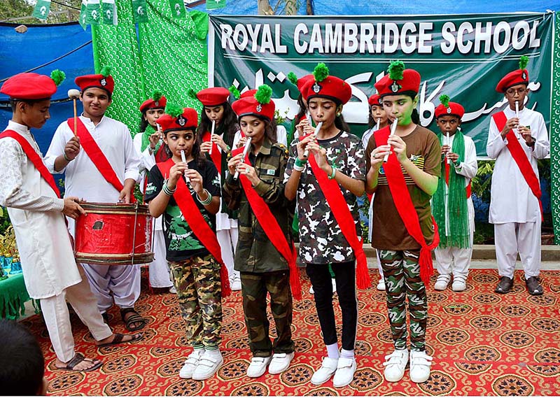 Students are performing tableau in connection with Pakistan Independence Day celebrations at RC School