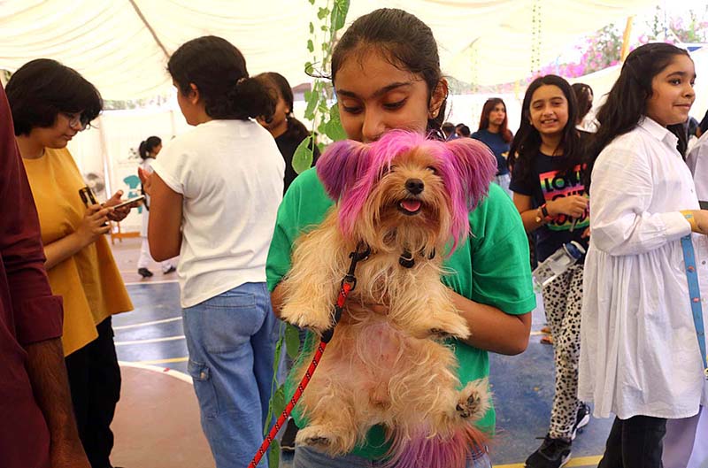 Participant poses with their pets during Pet Show organized at International School Clifton