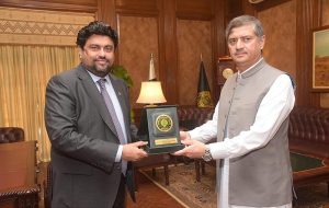 Governor Sindh Kamran Khan Tessori presenting the shield to the newly appointed Chief Secretary Dr. Muhammad Fakhre Alam Irfan