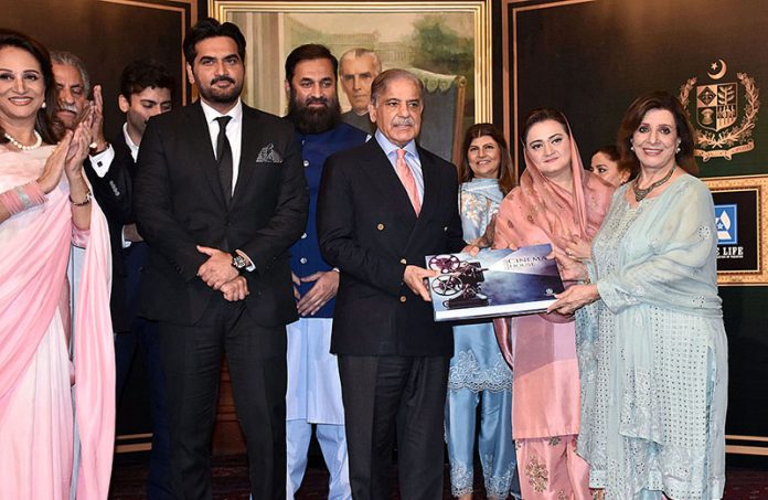 Prime Minister Shahbaz Sharif along with Federal Minister for Information and Broadcasting Marriyum Aurangzeb receives book from the Showbiz Persons during an event to celebrate Revival of Film Industry in Pakistan