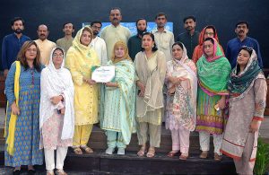 Vice Chancellor Women University Multan Prof. Dr. Kalsoom Paracha distributing certificate during the ceremony on the occasion of Defence Day of Pakistan.