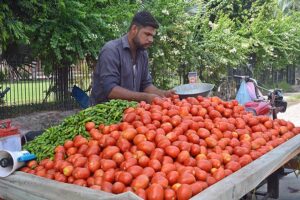 A vendor selling vegetables at Kalma chowk. 