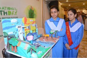 Students viewing science models during International Youth Day