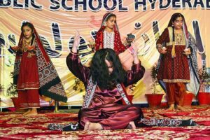 Students are performing the tableau on stage during Shah Latif day function on late Saturday night at Public school