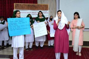 VC SBBWU Prof. Dr. Safiya Ahmed, Principal GGDC Bacha Khan Ms. Zoobia and Additional director HED Zahir Ali Shah in a group photo with other officials and students during one day workshop on Climate Justice at GGDC Bacha Khan Kohat road.