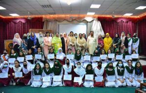 VC SBBWU Prof. Dr. Safiya Ahmed, Principal GGDC Bacha Khan Ms. Zoobia and Additional director HED Zahir Ali Shah in a group photo with other officials and students during one day workshop on Climate Justice at GGDC Bacha Khan Kohat road.