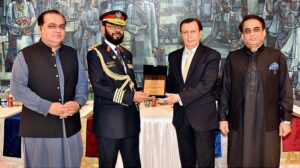 Secretary Senate, Mohammad Qasim Samad Khan presenting a shield to Syed Javed Azhar Hasni, Sargeant-at-Arms Senate Secretariat on his retirement from Senate Secretariat at Parliament House