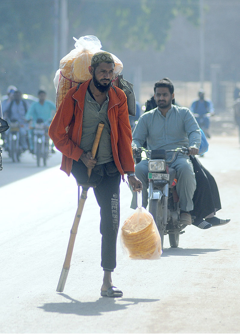 A Disabled Person Selling Edible Stuff While Shuttling On Khanewal Road 7169