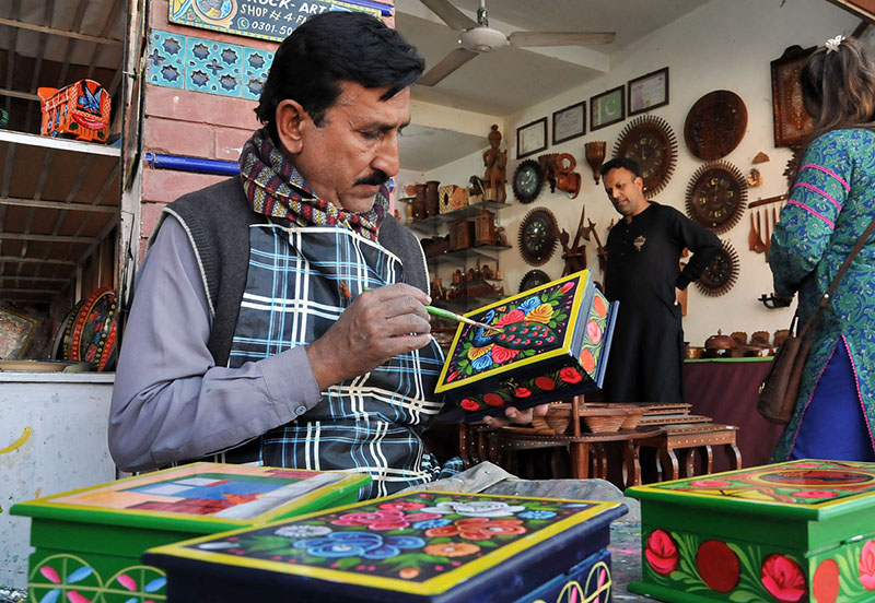 Woman visiting stall during “Folk Festival Lok Mela” at Lok Virsa.