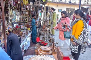 Artists performing traditional dance during “Folk Festival Lok Mela” at Lok Virsa.