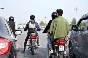  Bike rider is riding a bike without number plate and not wearing the helmet may cause any accident and needs attention of the concerned authorities in the Federal Capital at Jinnah Avenue. 