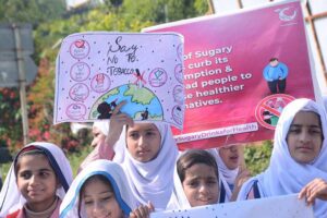 A large number of students participating in an awareness walk regarding Diabetes on the eve to mark World Diabetes Day organized by Pakistan National Heart Association at National Press Club Islamabad