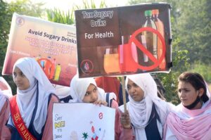 A large number of students participating in an awareness walk regarding Diabetes on the eve to mark World Diabetes Day organized by Pakistan National Heart Association at National Press Club Islamabad