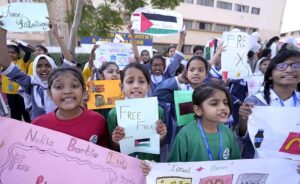 Students of Aisha Bawany Academy holding a protest demonstration in support of Palestinians at Shahrah-e-Faisal