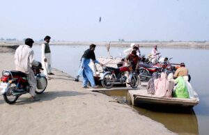 Old boats in very dilapidated condition are being used to provide transport facility to people as well as to motorcycles to cross river water of Sutlej River in suburb of the city. 