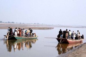 Old boats in very dilapidated condition are being used to provide transport facility to people as well as to motorcycles to cross river water of Sutlej River in suburb of the city.