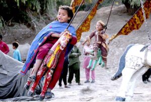 Children enjoy on swing at Ghazi Khan Khuhawar Village.