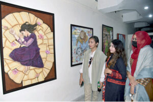 A group photo of participants of exhibition with Director General Food Authority, Asim Javed, famous cartoonist Javed Iqbal at Kopra Art Gallery