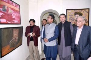 A group photo of participants of exhibition with Director General Food Authority, Asim Javed, famous cartoonist Javed Iqbal at Kopra Art Gallery