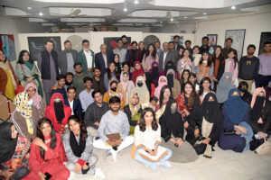 A group photo of participants of exhibition with Director General Food Authority, Asim Javed, famous cartoonist Javed Iqbal at Kopra Art Gallery