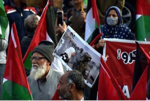 Activists of Civil Society holding Palestine Flags and placards during a protest demonstration to show solidarity with the people of Palestine and take part in an anti-Israel demonstration at Liberty Chowk