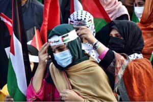 Activists of Civil Society holding Palestine Flags and placards during a protest demonstration to show solidarity with the people of Palestine and take part in an anti-Israel demonstration at Liberty Chowk