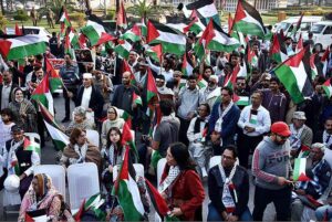 Activists of Civil Society holding Palestine Flags and placards during a protest demonstration to show solidarity with the people of Palestine and take part in an anti-Israel demonstration at Liberty Chowk