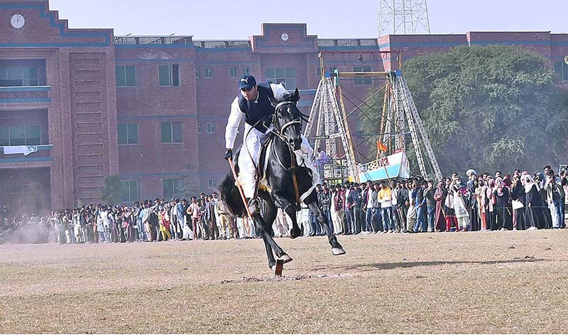 Horse Riders Are Participating In A Tent-pegging Competition During The 