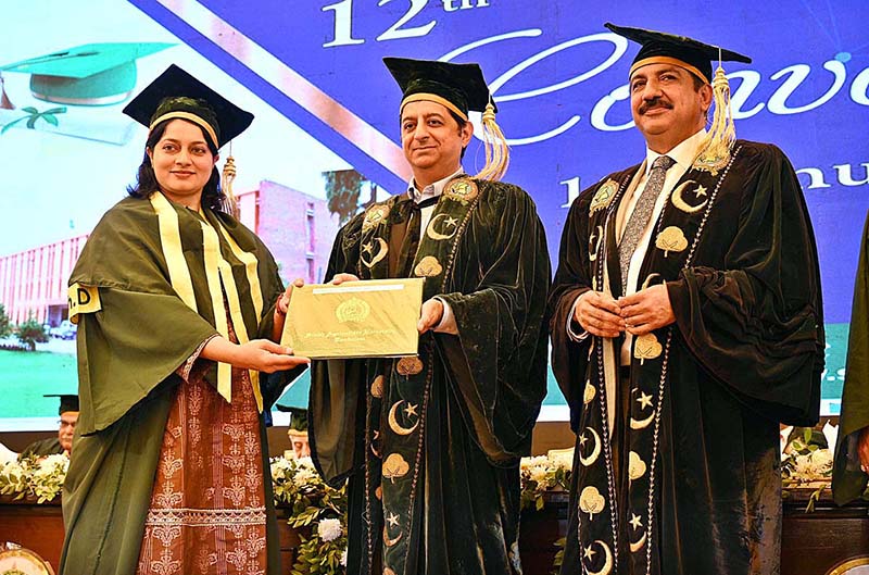 Caretaker minister for Tourism and Environment Arshad Wali Muhammad confers Gold Medal to a graduate during the 12th Convocation of Sindh Agriculture University Tandojam