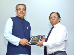  Caretaker Federal Minister for Religious Affairs and Interfaith Harmony Aneeq Ahmed is being presented with memento during the Seerat-un-Nabi Conference at Iqra University Karachi. 