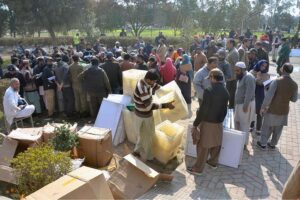 Polling staff receiving polling material at distribution Centre for General Elections 2024.