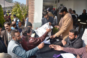 Polling staff receiving polling material at distribution Centre for General Elections 2024.