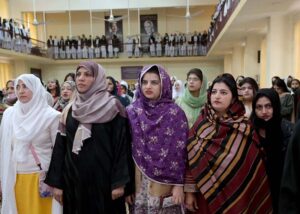 Teachers and students stand in respect of National anthem during inter collegiate Competition of milli naghma 2024 at IMCG Bhara Kahu