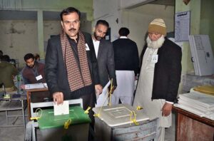  Candidate NA -57, Rashid Shafiq casts his vote in a polling station during General Elections-2024. 