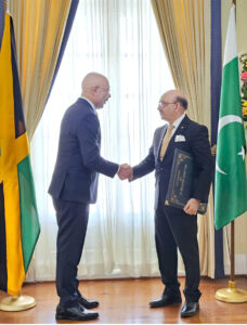 Ambassador Masood Khan presenting Letter of Credence as Non-Resident High Com- missioner to the Most Honorable Sir Patrick Linton Allen, Governor General of Jamaica.