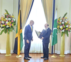 Ambassador Masood Khan presenting Letter of Credence as Non-Resident High Com- missioner to the Most Honorable Sir Patrick Linton Allen, Governor General of Jamaica.