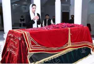 BiBi Aseefa Bhutto Zardari showering flowers on the grave of Shaheed Zulfaqar Ali Bhutoo at Garhi Khuda Bakhsh