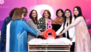 First Lady Begum Samina Alvi cutting cake to mark International Women's Day at an event organized by Serena Hotels