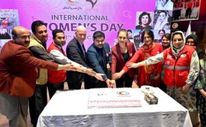 Chairman Pakistan Red Crescent Society, Sardar Shahid Ahmed Laghari and Ambassador of the Turkish Republic of Northern Cyprus in Pakistan Ms. Dilsad Senol along with the volunteers cutting cake at a seminar on International Women's Day Celebration under theme "Invest in Women Accelerate Progress"