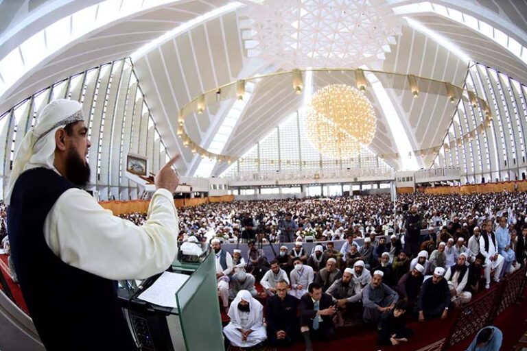 A religious scholar deliver Jumma Khutbah (sermon) at Faisal Masjid ...