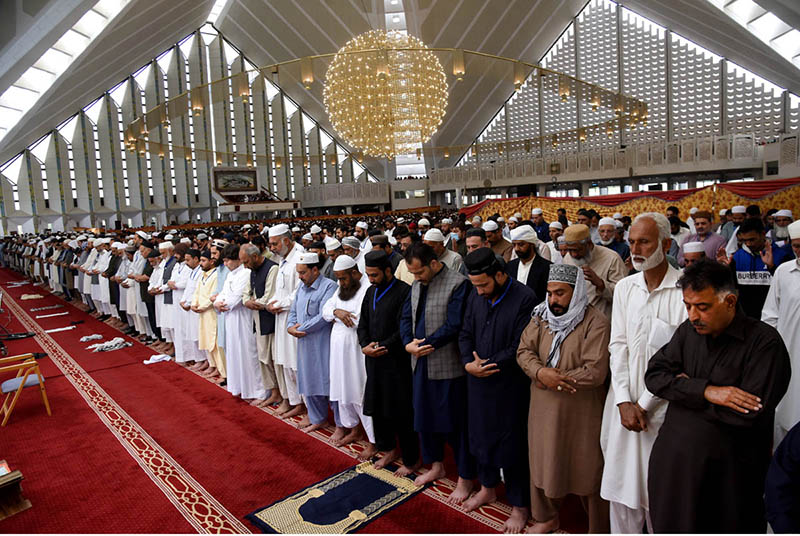 A religious scholar deliver Jumma Khutbah (sermon) at Faisal Masjid ...