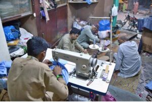 Tailors Are Busy In Stitching Clothes At Their Workplace In Islampura 