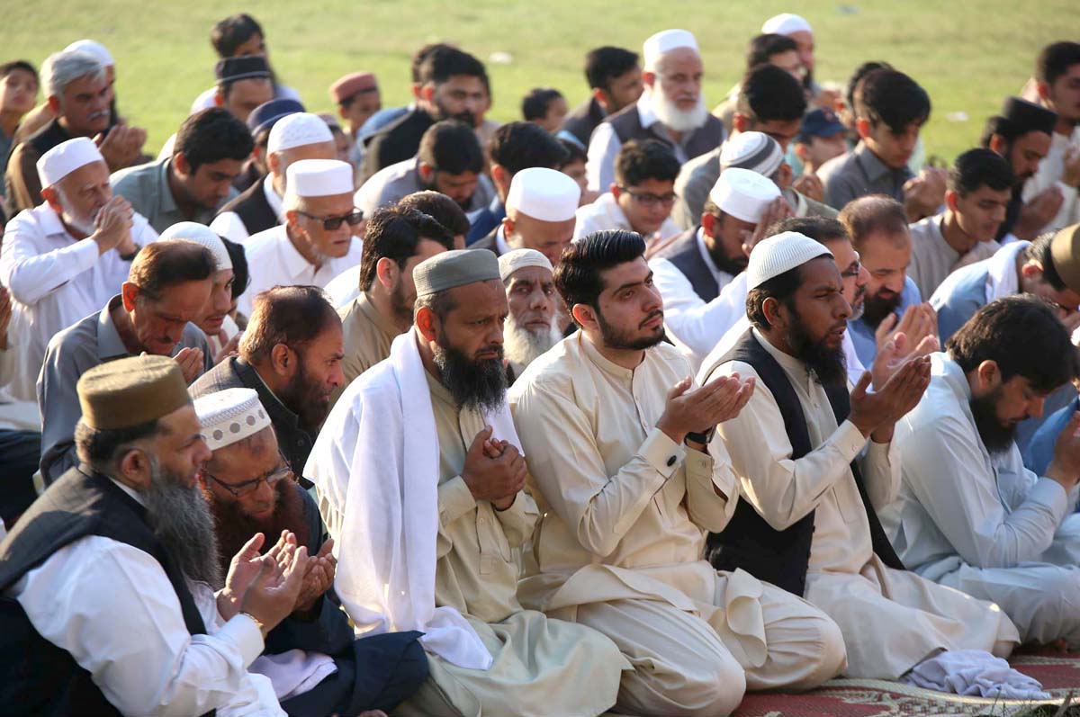 A large number of faithful offering Eid-ul-Fitr prayer at Eidgah Ground