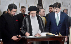 President of the Islamic Republic of Iran, Dr. Seyyed Ebrahim Raisi recording his remarks in the visitor book.