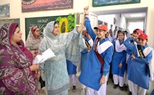 Principal Government Comprehensive Girls High School Robina Kausar announcing results during Student Council Election at Government Comprehensive Girls High School.