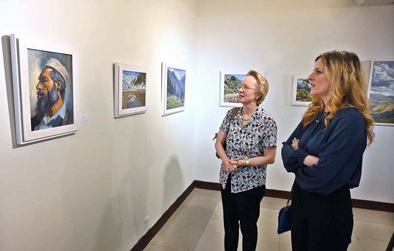 Visitors Viewing Paintings During Exhibition Impression Of Pakistan   APP53 210524Islamabad 