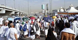 Hajj pilgrims going to Jamarat for performing Hajj ritual to throw pebbles at three pillars that represent Satan