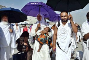 Hajj pilgrims going to Jamarat for performing Hajj ritual to throw pebbles at three pillars that represent Satan